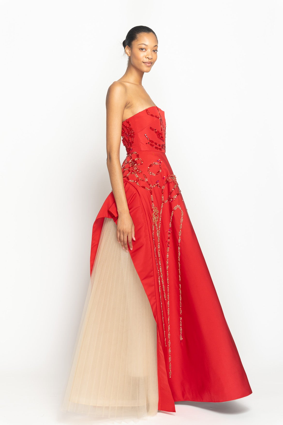Sindoor Faille Strapless Ball Gown with Hex Weave Embroidered Apron Skirt and Pleated Tulle Underskirt Side One