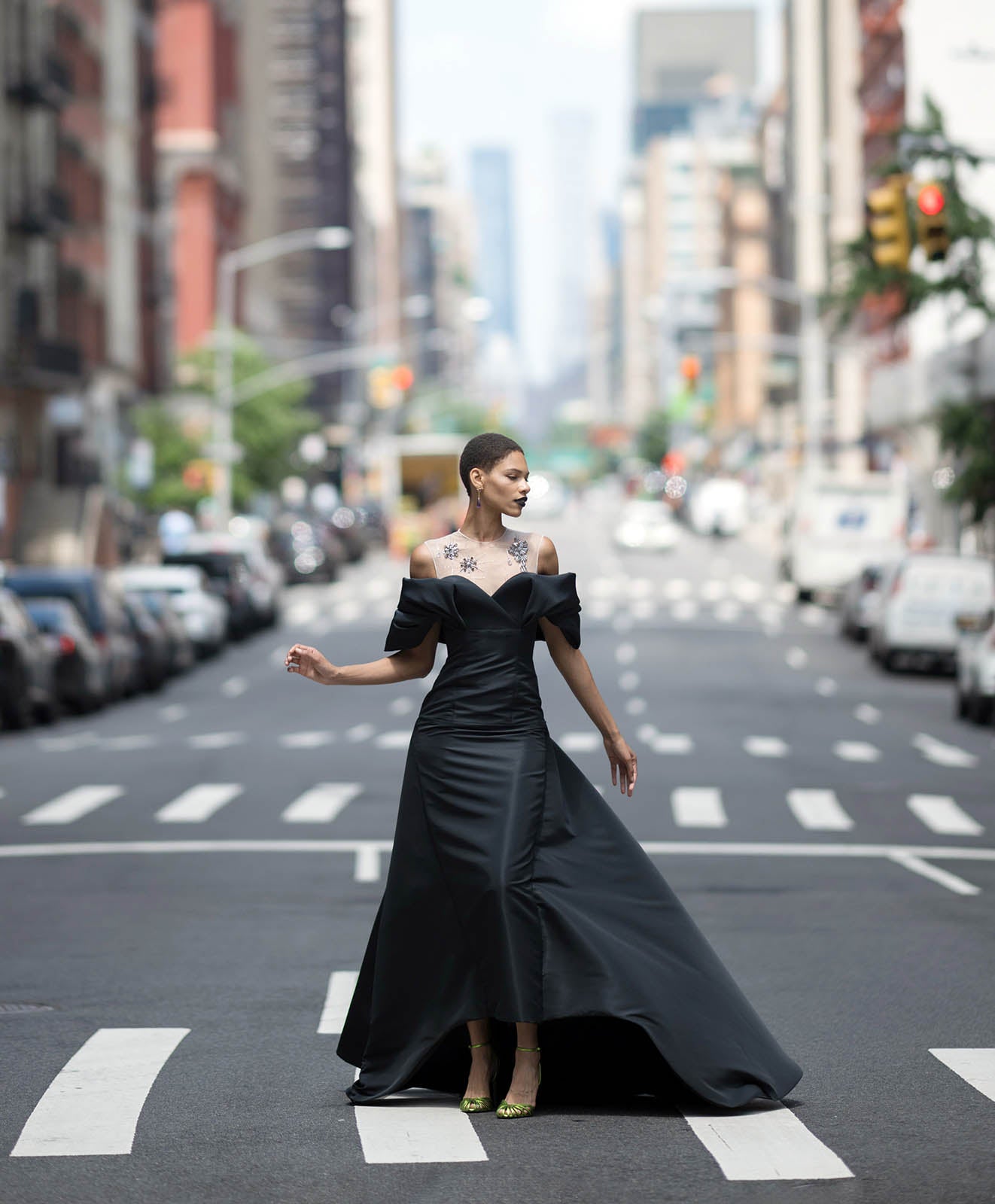 Model in New York City wearing black gown vertical look